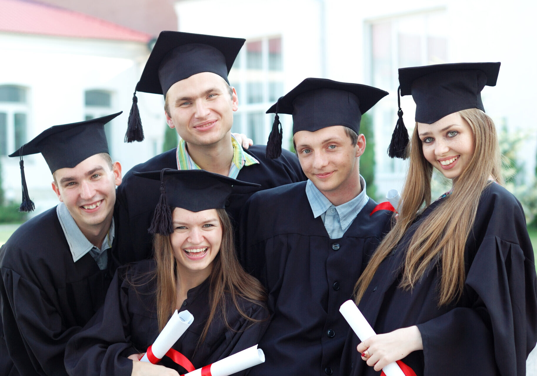 Graduates,Embrace,,Enjoy,And,Look,At,The,Camera.,Graduation,Of